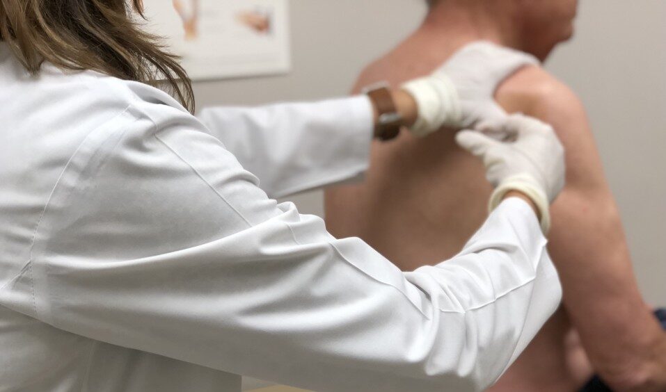 at the doctor s man getting a steroid injection in shoulder for torn rotator cuff nominated t20 R6OP2a e1683712896273