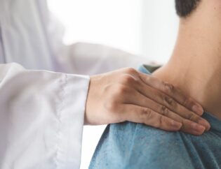 doctor doing neck adjustment in medical office t20 YwbmYR