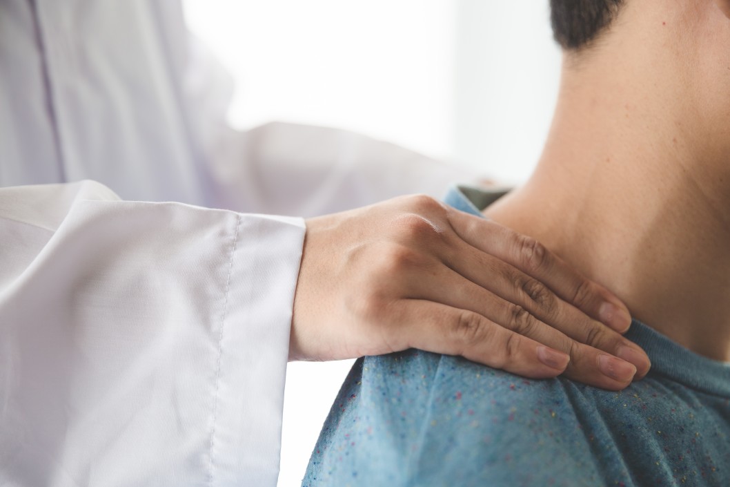 doctor doing neck adjustment in medical office t20 YwbmYR